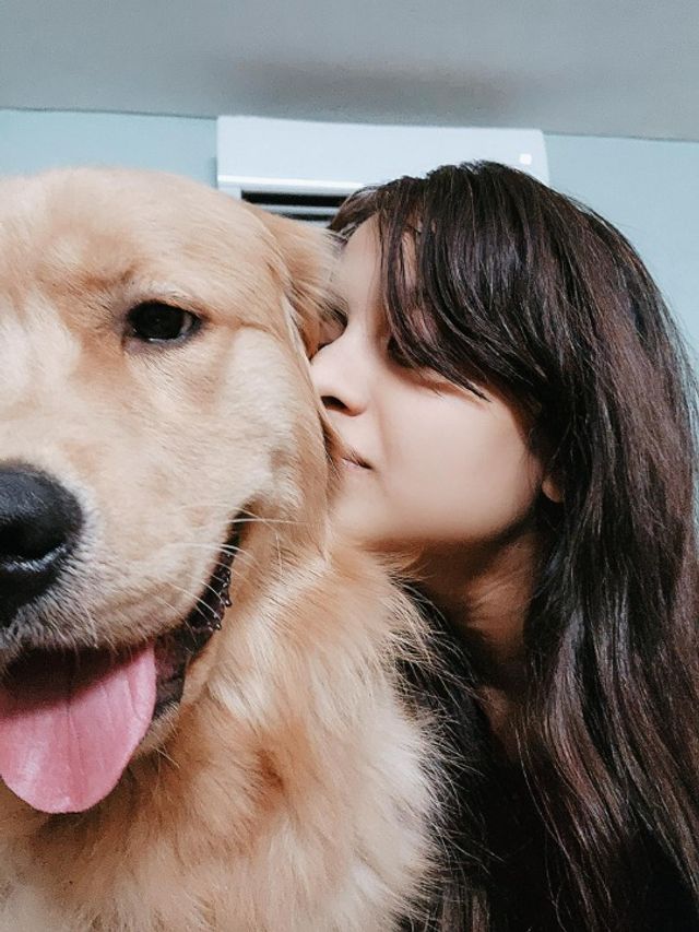 girl holding dog and garls